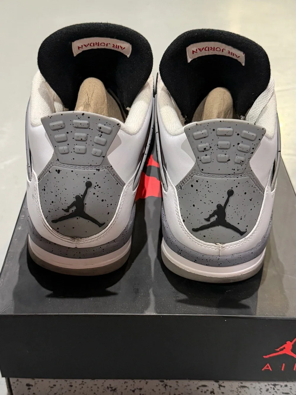 Jordan Men’s White/ Cement Gray/Black Retro 4 Sneakers with Red Jumpman